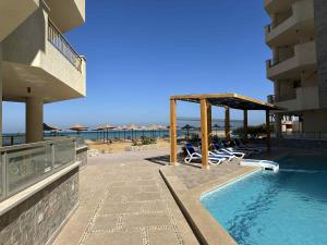 a resort with a swimming pool and a beach at La-Quinta Resort Erika in Hurghada