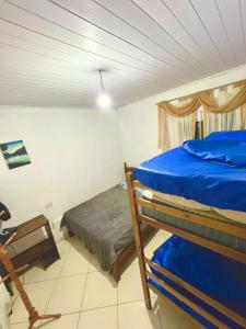 Postel nebo postele na pokoji v ubytování Recanto da Coruja