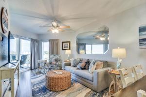 a living room with a couch and a table at Ocean View Top-Floor Sunset Vistas Condo! in St Pete Beach