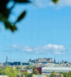 a view of a city with a bridge and buildings at Skyline View Apartment in Edinburgh