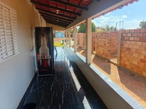 a hallway of a house with a poster on the wall at Hotel flor do alto in Água Boa +1 photo