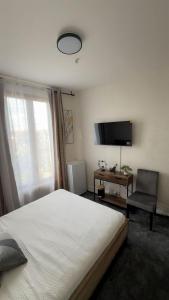 Et tv og/eller underholdning på REI Apartment, Cozy and Stylish