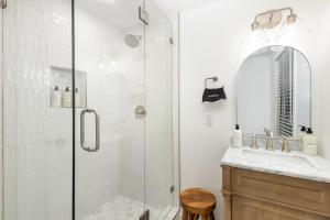 a bathroom with a shower and a sink at Walkable City Trendy Hideout for Foodies - 3BR-2BA in Charlotte