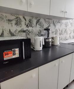 Køkken eller tekøkken på REI Apartment, Cozy and Stylish