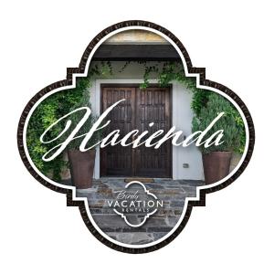 a sign that reads alhambra with a door at Hacienda - A Birdy Vacation Rental in San Antonio