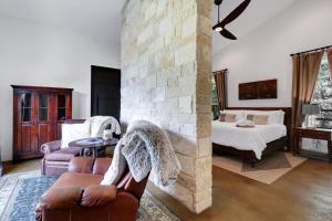 a living room with a couch and a bed at Hacienda - A Birdy Vacation Rental in San Antonio +90 photos