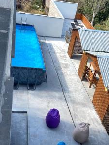 an overhead view of a swimming pool with blue water at AVAGYAN'S Hotel-restaurant in Goris