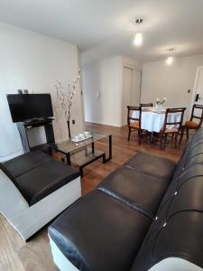 Μια τηλεόραση ή/και κέντρο ψυχαγωγίας στο Flamante Apartamento, Cálido e Iluminado con una Vista Panorámica