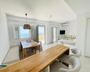 a living room with a table and a couch at Arnados Residence in Kékhros