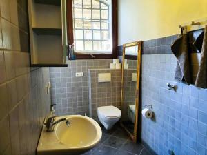 a bathroom with a sink and a toilet at Glamour-Camping in Hanshagen