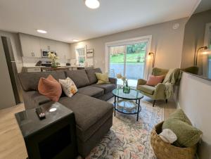 a living room with a couch and a table at Oakview Hideaway in Victoria