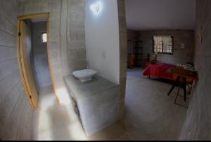a bathroom with a tub and a sink in a room at Casa Camino Real in Yelateni