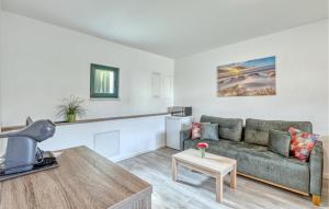 a living room with a couch and a table at Beautiful Apartment In Altenkirchen in Altenkirchen