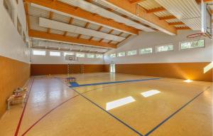 a volleyball court in a gym with a basketball hoop at 3 Bedroom Awesome Apartment In Altenkirchen in Altenkirchen