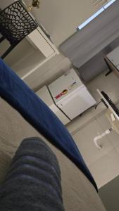 a person laying on a couch in a room at Flats 1778 N01 Orla de Petrolina in Petrolina