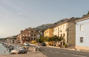 a town with boats in the water and buildings at Gorgeous Apartment In Karlobag With Wifi in Karlobag +17 photos