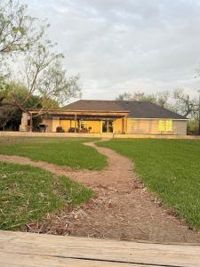a house with a dirt road in front of it at Nature's Retreat- A Bird Watchers Dream Location in San Benito