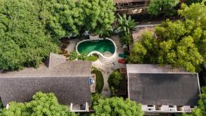 an overhead view of a house with a swimming pool at Serene Beach Villa in Gili Trawangan