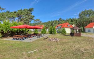 a picnic area with picnic tables and a gazebo at 3 Bedroom Stunning Apartment In Altenkirchen in Altenkirchen +38 photos