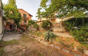 an empty yard in front of a house at Gorgeous Apartment In Karlobag With Wifi in Karlobag
