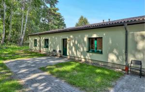 a building with chairs parked outside of it at 3 Bedroom Stunning Apartment In Altenkirchen in Altenkirchen