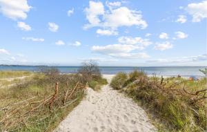 a path through the sand on a beach at 3 Bedroom Beautiful Apartment In Altenkirchen in Altenkirchen