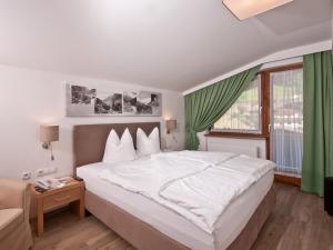 Posteľ alebo postele v izbe v ubytovaní Hotel Neuwirt