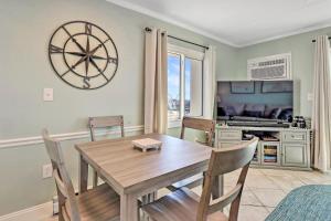a dining room with a wooden table and chairs at Couple's Corner - 2 Blocks to the Boardwalk - Panoramic Views of Assateague Island, Bay and Ocean - Assateague House 411 in Ocean City +29 photos
