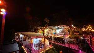 a view of a building with domes at night at ปลายเขื่อนแคมป์ปิ้ง Dom in Sirindhorn