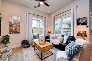 a living room with a couch and a table at 5 mins to Downtown - Tesla Charger - Sleeps 6 in Houston