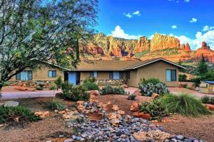 a house with a mountain in the background at Uptown Sedona Prime Location, Hot tub and views in Sedona