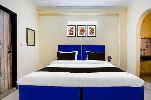 Postel nebo postele na pokoji v ubytování Collection O Sheetla Colony