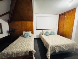 Postel nebo postele na pokoji v ubytování Monterrico Polo Apart 4 - Frente Embajada USA