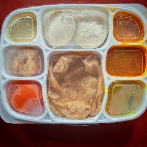 a plastic container filled with different types of food at Abaca AuroVibe in Kuilapayam