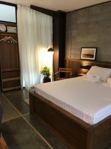 a bedroom with a large bed in a room at Vessel Hostel in San Juan +4 photos