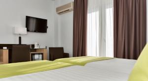 Postel nebo postele na pokoji v ubytování Hotel Baviera