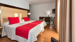 Postel nebo postele na pokoji v ubytování Hotel Baviera