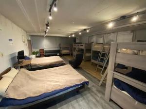 Postel nebo postele na pokoji v ubytování 紀伊国屋ビル