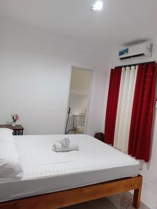 Ένα ή περισσότερα κρεβάτια σε δωμάτιο στο M and A Guesthouse