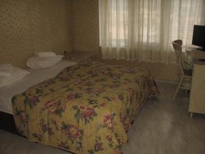 Postel nebo postele na pokoji v ubytování Family Hotel Kartala