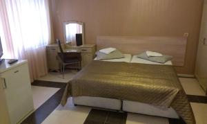 Postel nebo postele na pokoji v ubytování Family Hotel Kartala