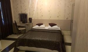 Postel nebo postele na pokoji v ubytování Family Hotel Kartala