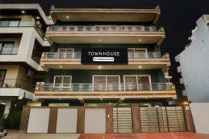 a building with a sign for a townhouse at Super Townhouse Subhash Chowk Near Medanta Hospital Formerly L B Residency in Gurgaon