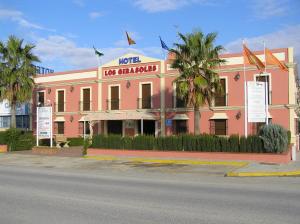 
a large building with a sign on the side of it at Hotel los Girasoles in Valencina de la Concepción
