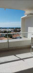 a balcony of a building with a view of the ocean at Playa del ingles Tamaran apartamento 509 in Maspalomas