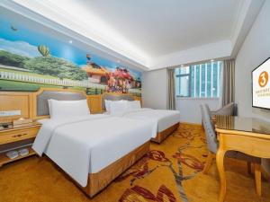 Ένα ή περισσότερα κρεβάτια σε δωμάτιο στο Vienna 3 Best Xiaoshan Qianjiang Century City +161 φωτογραφίες