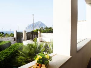 a view from the balcony of a house with flowers at Case Vacanza Tra I Due Monti in Valderice