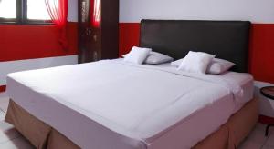 Кровать или кровати в номере Hotel O Permata Ria Hotel +32 фотографии