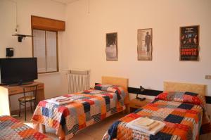 Postel nebo postele na pokoji v ubytování Albergo Roma