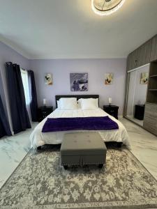 a bedroom with a large bed and a large rug at Luxury Haven- Near AC Marriott Hotel Kingston in Kingston +17 photos